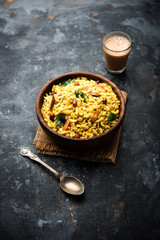 Jada Poha Namkeen Chivda / Thick Pohe Chiwda is a jar snack with a mix of sweet, salty and nuts flavours, served with tea. selective focus