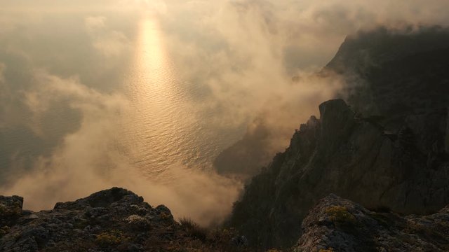 Beautiful dramatic sunset with colorful clouds and wonderful coastline from above on Cape Aya in Crimea.