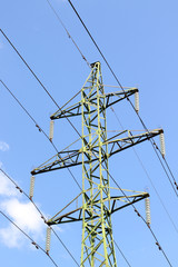 high voltage tower and cloudy sky