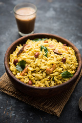 Jada Poha Namkeen Chivda / Thick Pohe Chiwda is a jar snack with a mix of sweet, salty and nuts flavours, served with tea. selective focus