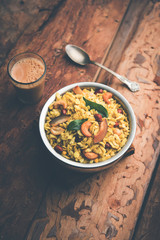Jada Poha Namkeen Chivda / Thick Pohe Chiwda is a jar snack with a mix of sweet, salty and nuts flavours, served with tea. selective focus