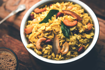 Jada Poha Namkeen Chivda / Thick Pohe Chiwda is a jar snack with a mix of sweet, salty and nuts flavours, served with tea. selective focus