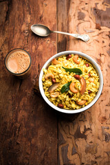 Jada Poha Namkeen Chivda / Thick Pohe Chiwda is a jar snack with a mix of sweet, salty and nuts flavours, served with tea. selective focus