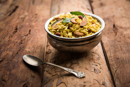 Jada Poha Namkeen Chivda / Thick Pohe Chiwda is a jar snack with a mix of sweet, salty and nuts flavours, served with tea. selective focus