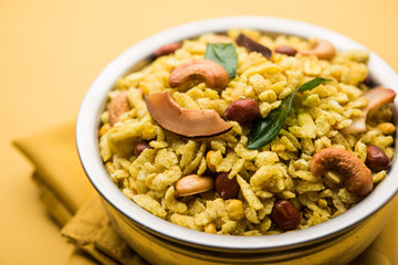 Jada Poha Namkeen Chivda / Thick Pohe Chiwda is a jar snack with a mix of sweet, salty and nuts flavours, served with tea. selective focus