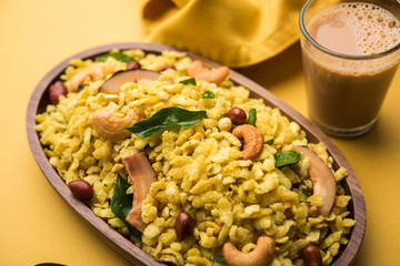 Jada Poha Namkeen Chivda / Thick Pohe Chiwda is a jar snack with a mix of sweet, salty and nuts flavours, served with tea. selective focus