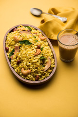 Jada Poha Namkeen Chivda / Thick Pohe Chiwda is a jar snack with a mix of sweet, salty and nuts flavours, served with tea. selective focus