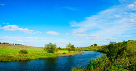 Sunny landscape with river