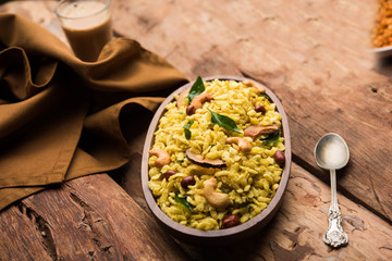 Jada Poha Namkeen Chivda / Thick Pohe Chiwda is a jar snack with a mix of sweet, salty and nuts flavours, served with tea. selective focus