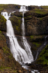 Fototapeta premium Long exposure photo of waterfall, view of the Hengifoss waterfall in Iceland, Europe.
