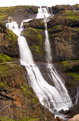 Fototapeta na wymiar Long exposure photo of waterfall, view of the Hengifoss waterfall in Iceland, Europe.