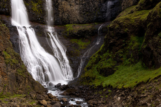 Long exposure photo of waterfall, view of the Hengifoss waterfall in Iceland, Europe.