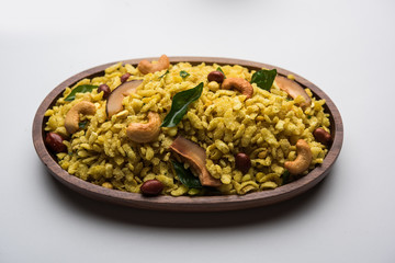 Jada Poha Namkeen Chivda / Thick Pohe Chiwda is a jar snack with a mix of sweet, salty and nuts flavours, served with tea. selective focus