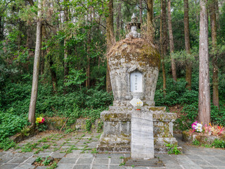 Grave at a Buddhist cloister in the City of Dali (China). On the outside there is written the Name...