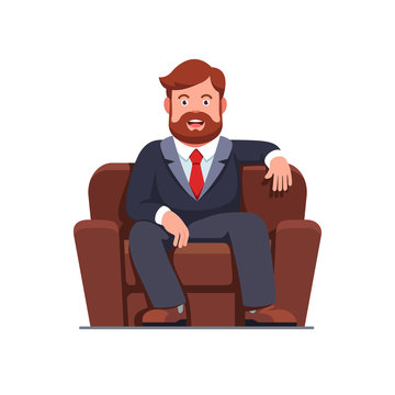 Bbearded business man sitting on home arm chair
