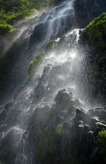 La Virgen Falls in Banos, Ecuador, cascading over black basalt deposited by the nearby Volcan Tungurahua.