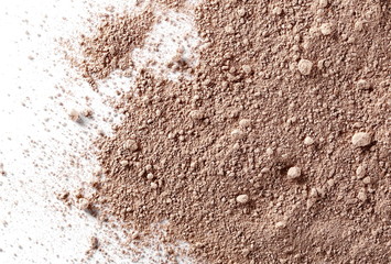 Milled chocolate powder isolated on white background, top view