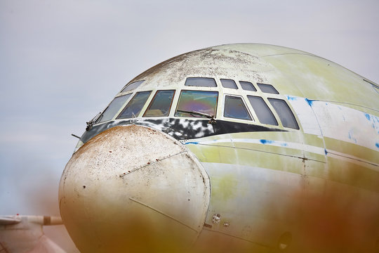 Old scratched military transport, cargo plane close-up.
