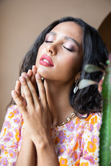 Obraz premium Portrait of dreaming tender girl in flowery blouse