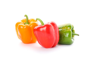 Different bell peppers isolated on white background
