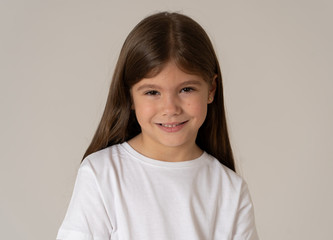 Portrait of a beautiful clever child with a happy, cheerful face looking confident. Human emotions
