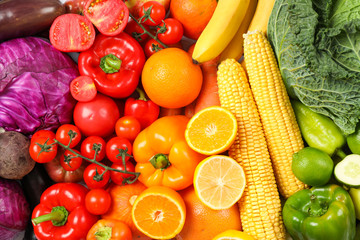 Fototapeta na wymiar Ripe vegetables and fruits on whole background, close up