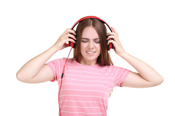 Fototapeta na wymiar Young beautiful woman with headphones on white background