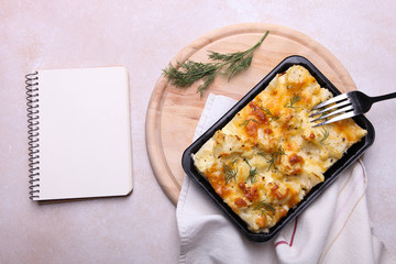 Baked cauliflower on wooden cutting board
