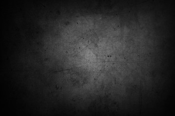 Textured black grunge concrete wall background