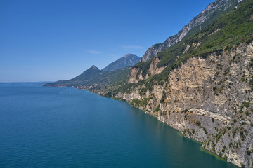 Fototapeta na wymiar Aerial photography with drone. Steep Cliffs By the Water, Lake Garda, Italy.