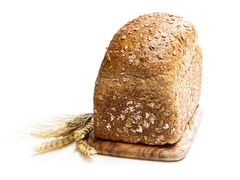 Homemade wholemeal rye bread with pearl barley isolated on white