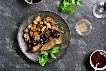 Slow cooked beef with mushrooms and blueberry sauce