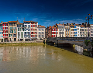 Colorful houses at the Nive river embankment in Bayonne, France
