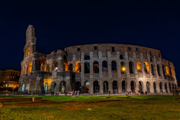 Fototapeta na wymiar Colosseum at night with people