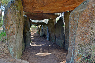Prehistoric dolmen near megalithic menhirs alignment. Carnac, Brittany. France