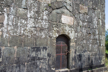 Fototapeta premium Closed Old metal, iron Door In A Wall. Doorway of a thirteenth century medieval castle