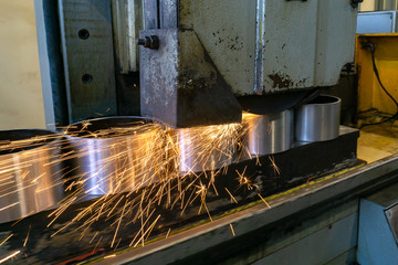 Flat grinding of metal on a machine with sparks, technological grinding of parts alignment.