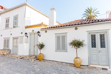Traditional mediterranean white house. Greek white housem, Narrow traditional white street in the town of Hydra, Hydra island, Greece