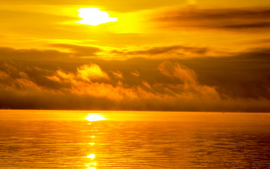dawn on the lake in the fog