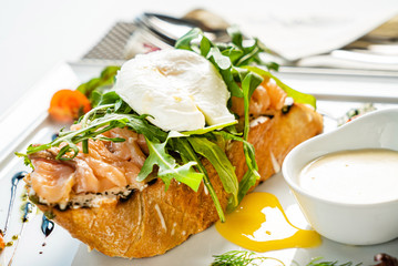 sandwich with salted salmon and poached egg