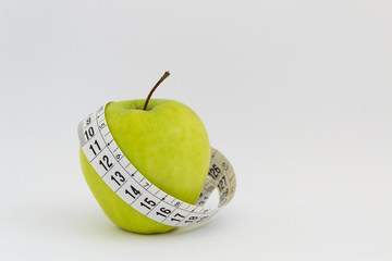 apple with measuring tape weight body control isolated on white background