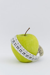 apple with measuring tape vertical isolated on white background