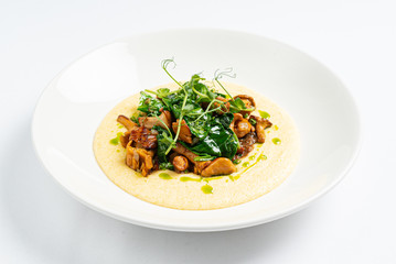 polenta with chanterelles on the white plate