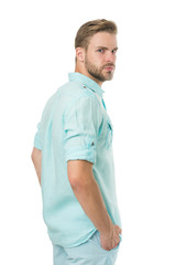 Obraz premium Casual summer style. Handsome man keeping arms in pockets in casual wear isolated on white. Confident guy wearing casual street trend. Styling casual wear for young men