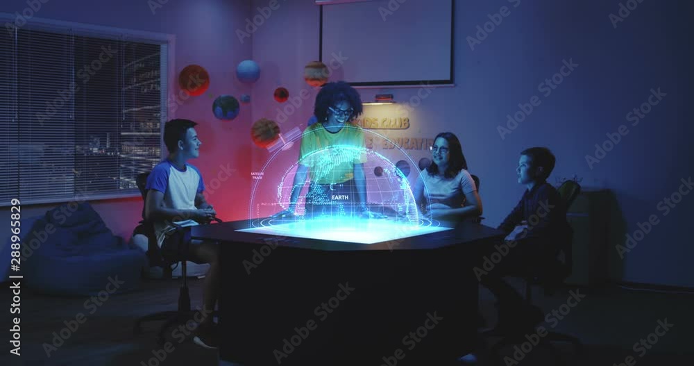 Canvas Prints teacher using a planet earth hologram in class