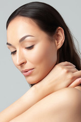 Young beautiful woman with clean perfect skin close-up.