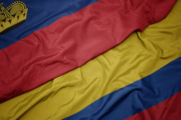 waving colorful flag of colombia and national flag of liechtenstein.