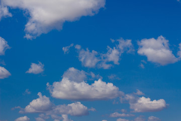 Naklejka na ściany i meble White clouds in a blue sky