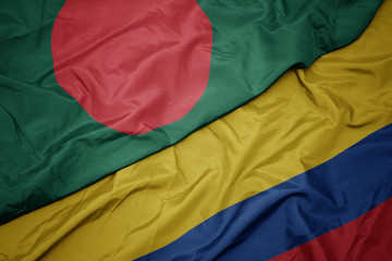 waving colorful flag of colombia and national flag of bangladesh.