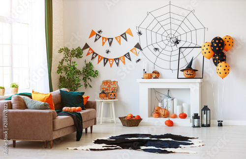 interior of house decorated for Halloween pumpkins, webs and spiders.